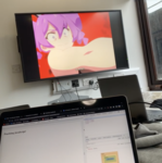 Inside a breakout room in the library with the Otachan Show playing on the big monitor